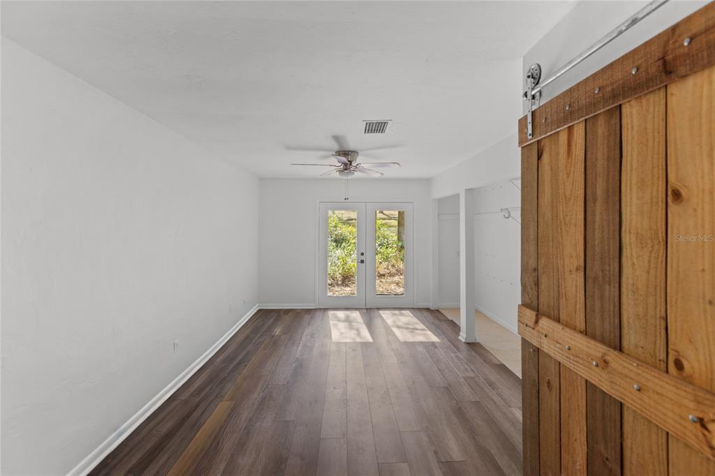 730 Highway 26 Melrose, FL 32666 - Photo 65 of 80 a view of room with window and wooden floor