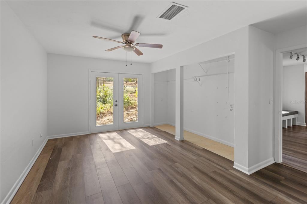 730 Highway 26 Melrose, FL 32666 - Photo 71 of 80 wooden floor in an empty room with a window