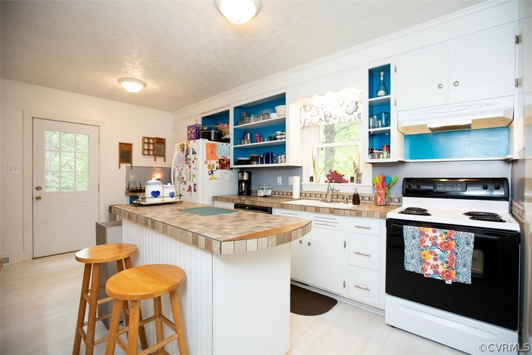 1213 West Osborn Road Farmville, VA 23901 - Photo 13 of 37 a kitchen with a stove a sink and a refrigerator