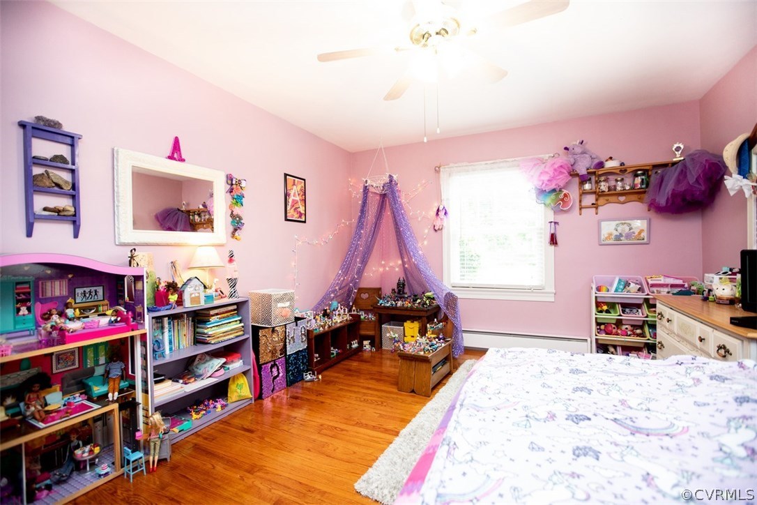 1213 West Osborn Road Farmville, VA 23901 - Photo 25 of 37 a bed room with a bed and a wooden floor
