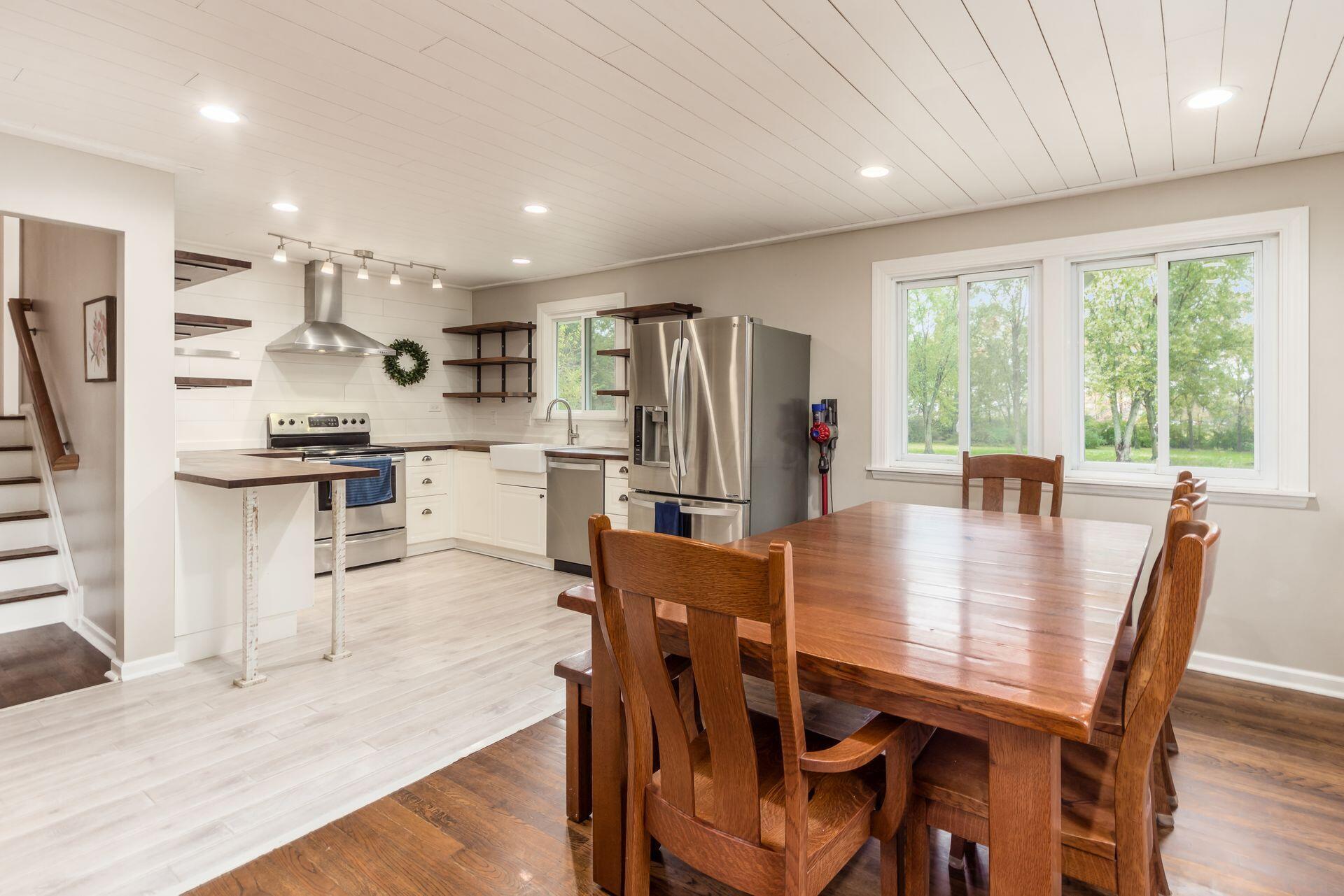 9221 London Road Orient, OH 43146 - Photo 17 of 51 Open concept dining room and kitchen with shiplap ceiling, lots of light and loads of storage. Measures 12'9" x 22'3"