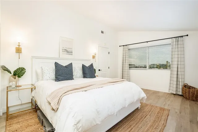 a large white bed in a white room