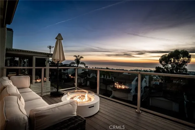 a living room with furniture a floor and kitchen view