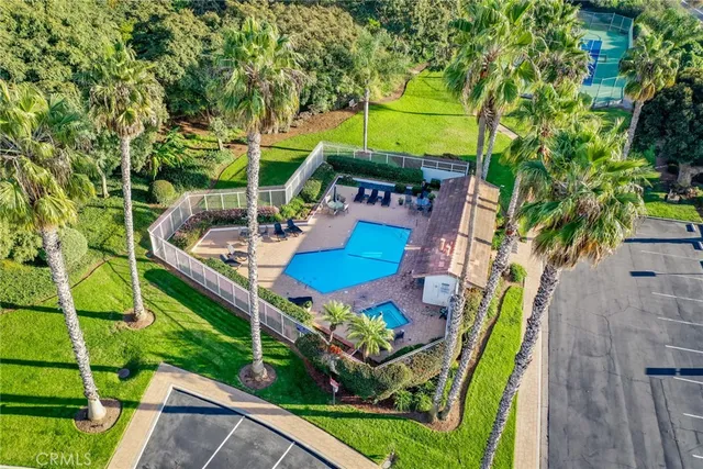 an aerial view of a house with a garden and trees