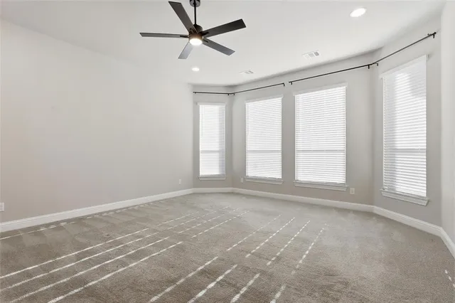 a spacious bathroom with a double vanity sink a mirror and shower