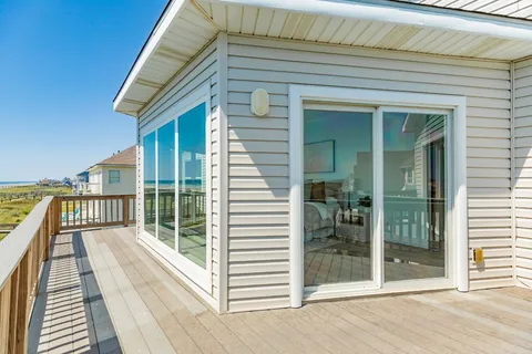 a view of balcony with wooden floor