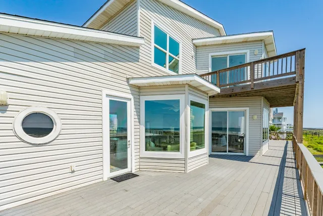 a view of a house with a sink and large windows