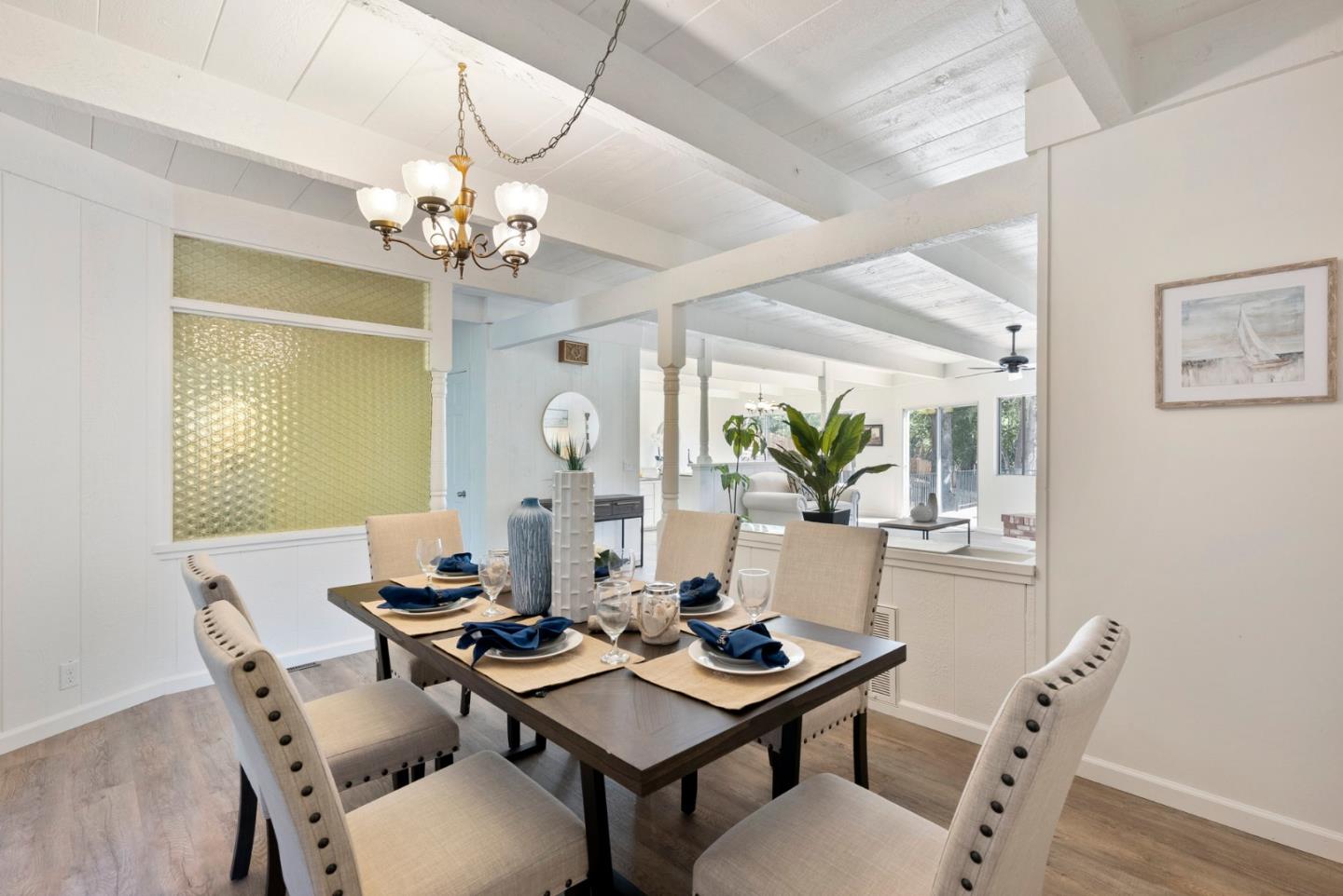 1272 Castro Road Monterey, CA 93940 - Photo 16 of 54 a view of a dining room with furniture window and wooden floor