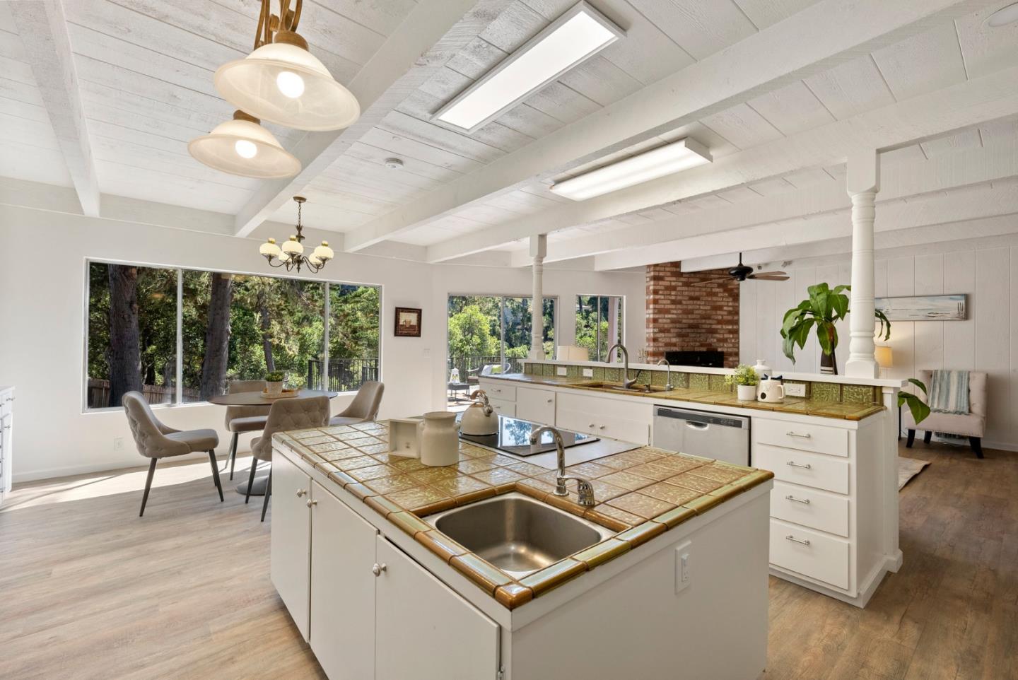 1272 Castro Road Monterey, CA 93940 - Photo 21 of 54 a dining hall with stainless steel appliances granite countertop a sink and cabinets with wooden floor