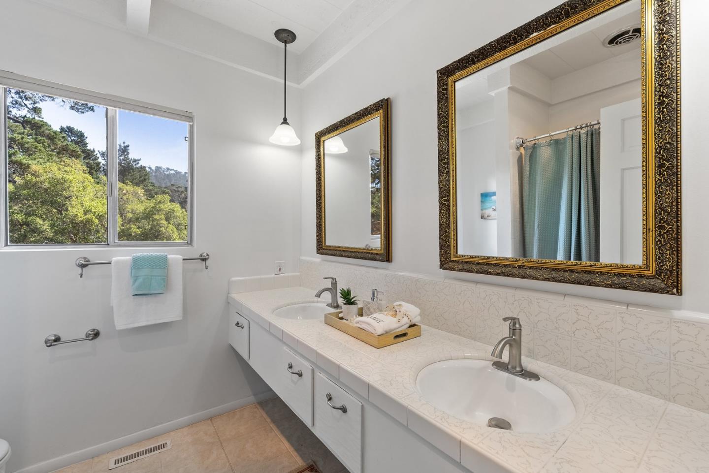 1272 Castro Road Monterey, CA 93940 - Photo 42 of 54 a bathroom with a double vanity sink mirror and
