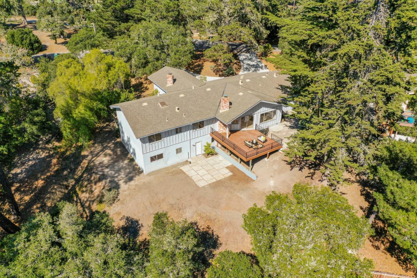 1272 Castro Road Monterey, CA 93940 - Photo 6 of 54 an aerial view of a house with a yard and trees all around