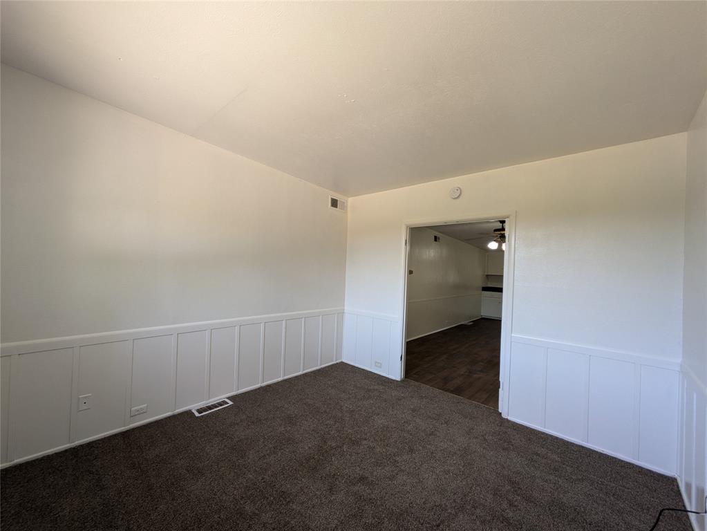 710 Boulevard Boulevard North Dallas, TX 75211 - Photo 12 of 21 an empty room with an entrance to other room