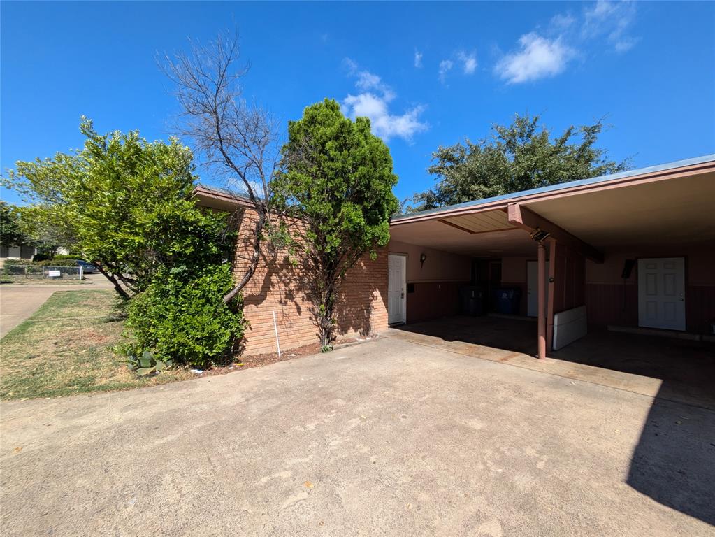 710 Boulevard Boulevard North Dallas, TX 75211 - Photo 2 of 21 a view of a house with a yard and potted plants