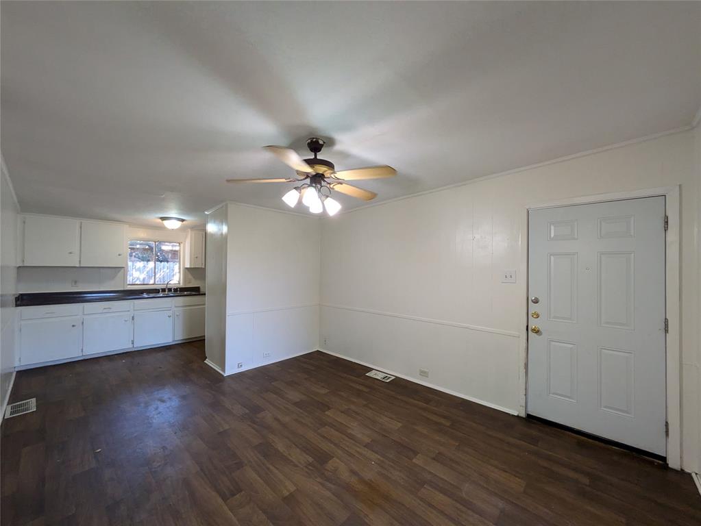 710 Boulevard Boulevard North Dallas, TX 75211 - Photo 5 of 21 a view of a kitchen with a dishwasher cabinets and wooden floor