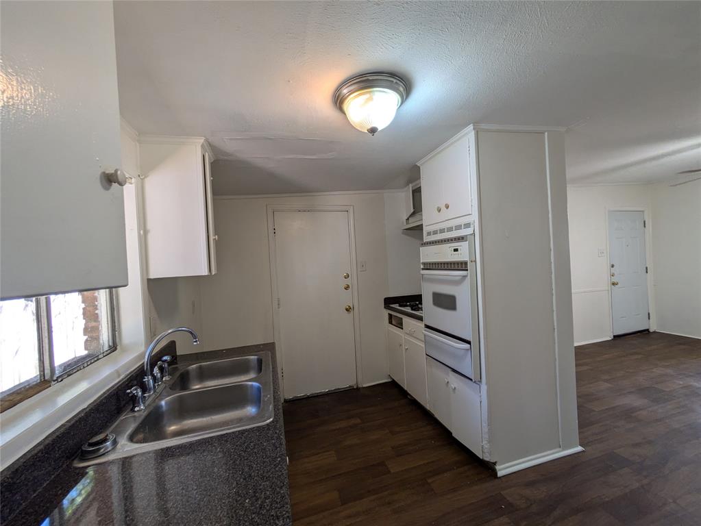 710 Boulevard Boulevard North Dallas, TX 75211 - Photo 8 of 21 a kitchen with a refrigerator stove and sink