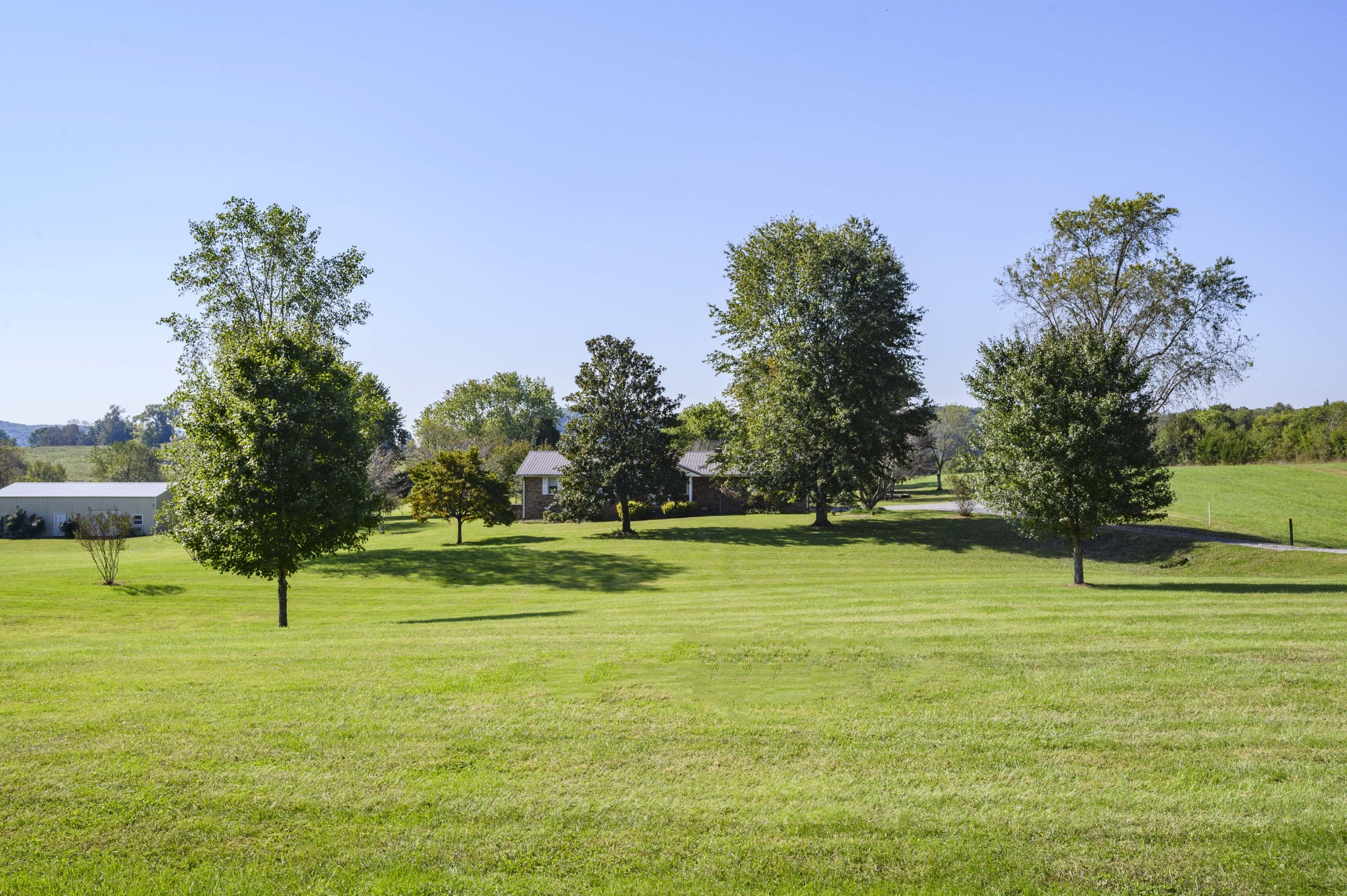 1430 Cedar Bluff Road Lebanon, TN 37087 - Photo 3 of 27 a swimming pool with trees in the background