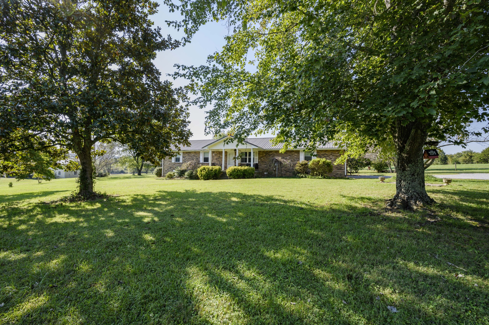 1430 Cedar Bluff Road Lebanon, TN 37087 - Photo 4 of 27 a view of house with garden and trees