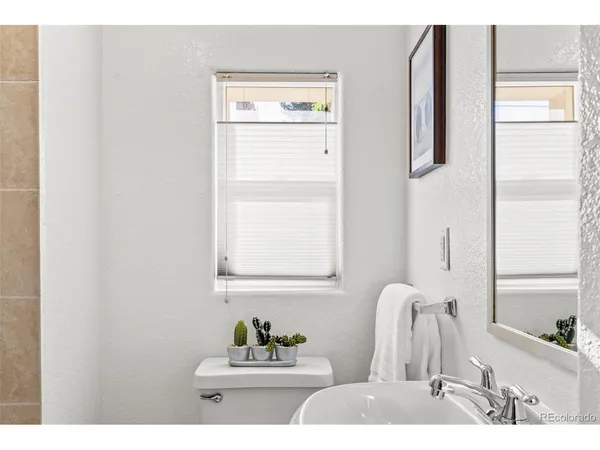 a bathroom with a sink vanity and a mirror