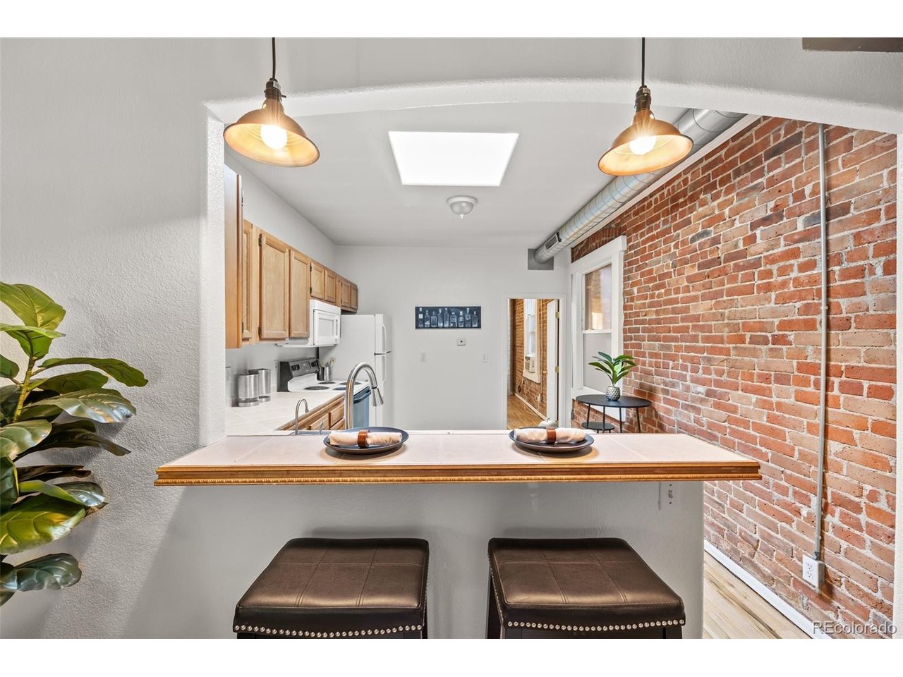 321 Inca Street Denver, CO 80223 - Photo 5 of 27 a bathroom with a sink and a mirror