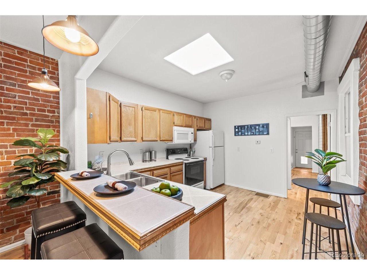 321 Inca Street Denver, CO 80223 - Photo 6 of 27 a living room with a table and chairs