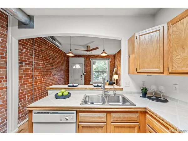 a kitchen with a sink and a window