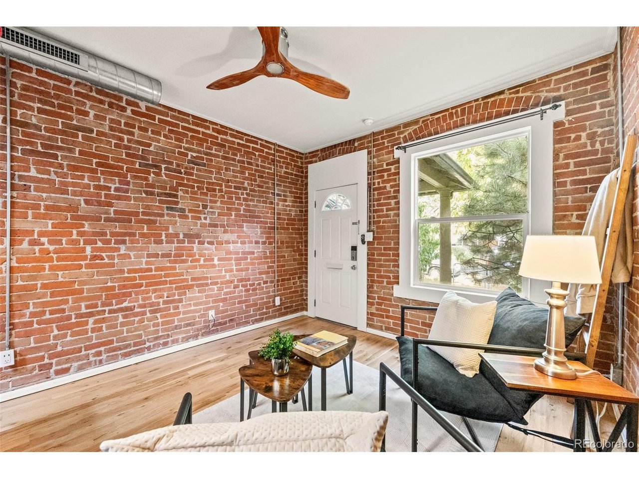 321 Inca Street Denver, CO 80223 - Photo 10 of 27 a balcony with chairs and table