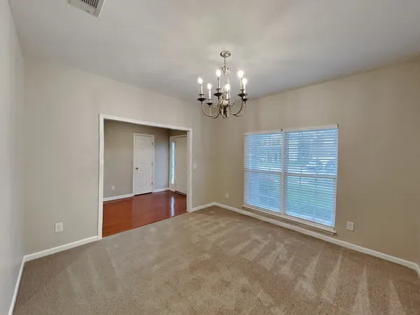 a view of an empty room with a bathroom