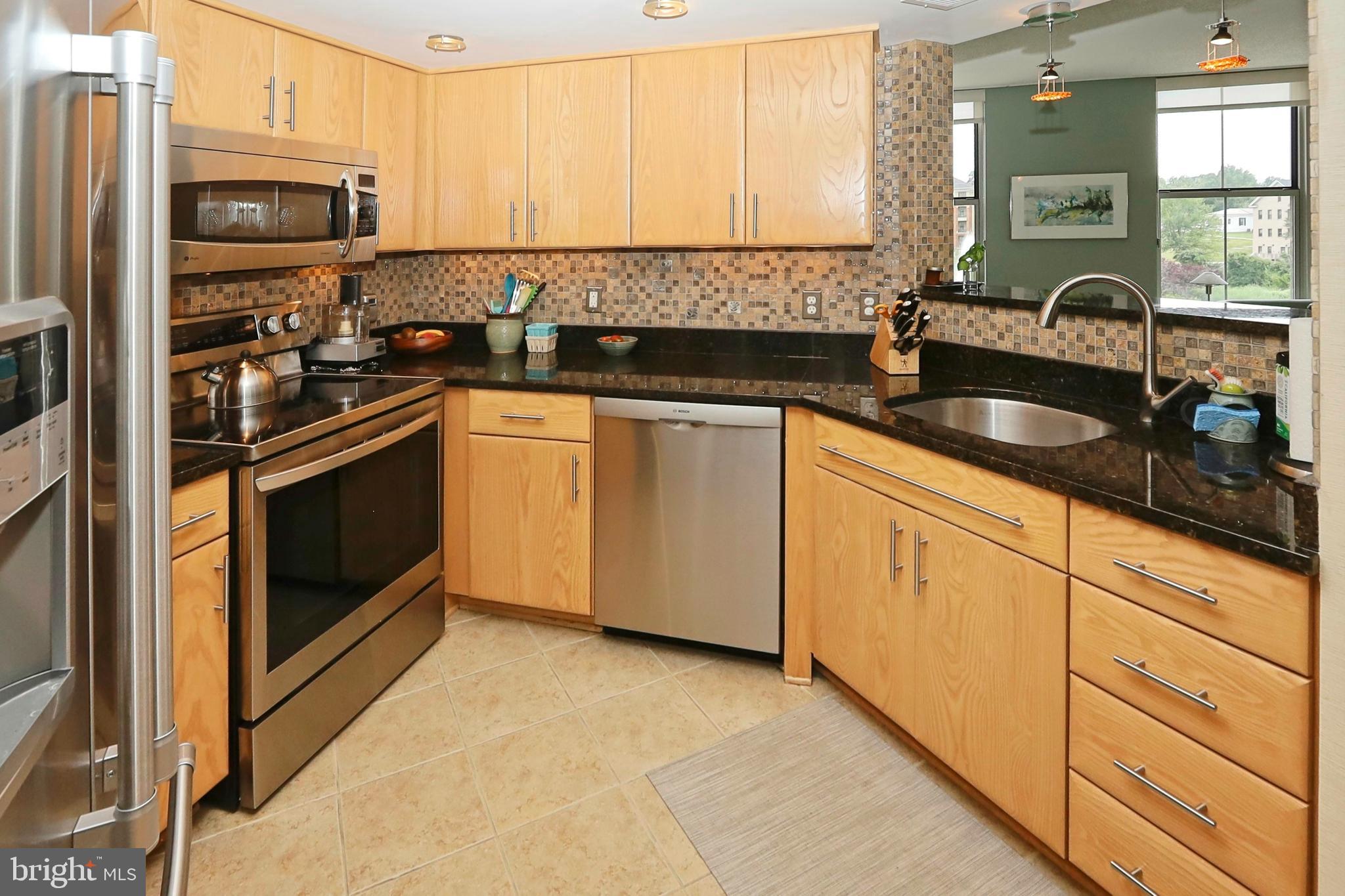 11800 Sunset Hills Road, Unit 222 Reston, VA 20190 - Photo 17 of 62 Large tile and granite tops throughout the kitchen