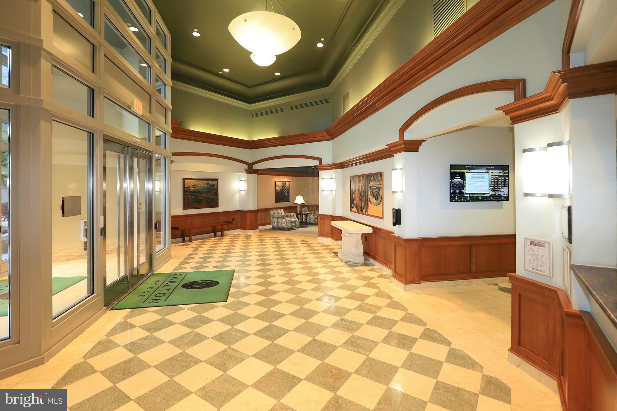 11800 Sunset Hills Road, Unit 222 Reston, VA 20190 - Photo 4 of 62 Spacious entry with front desk concierge