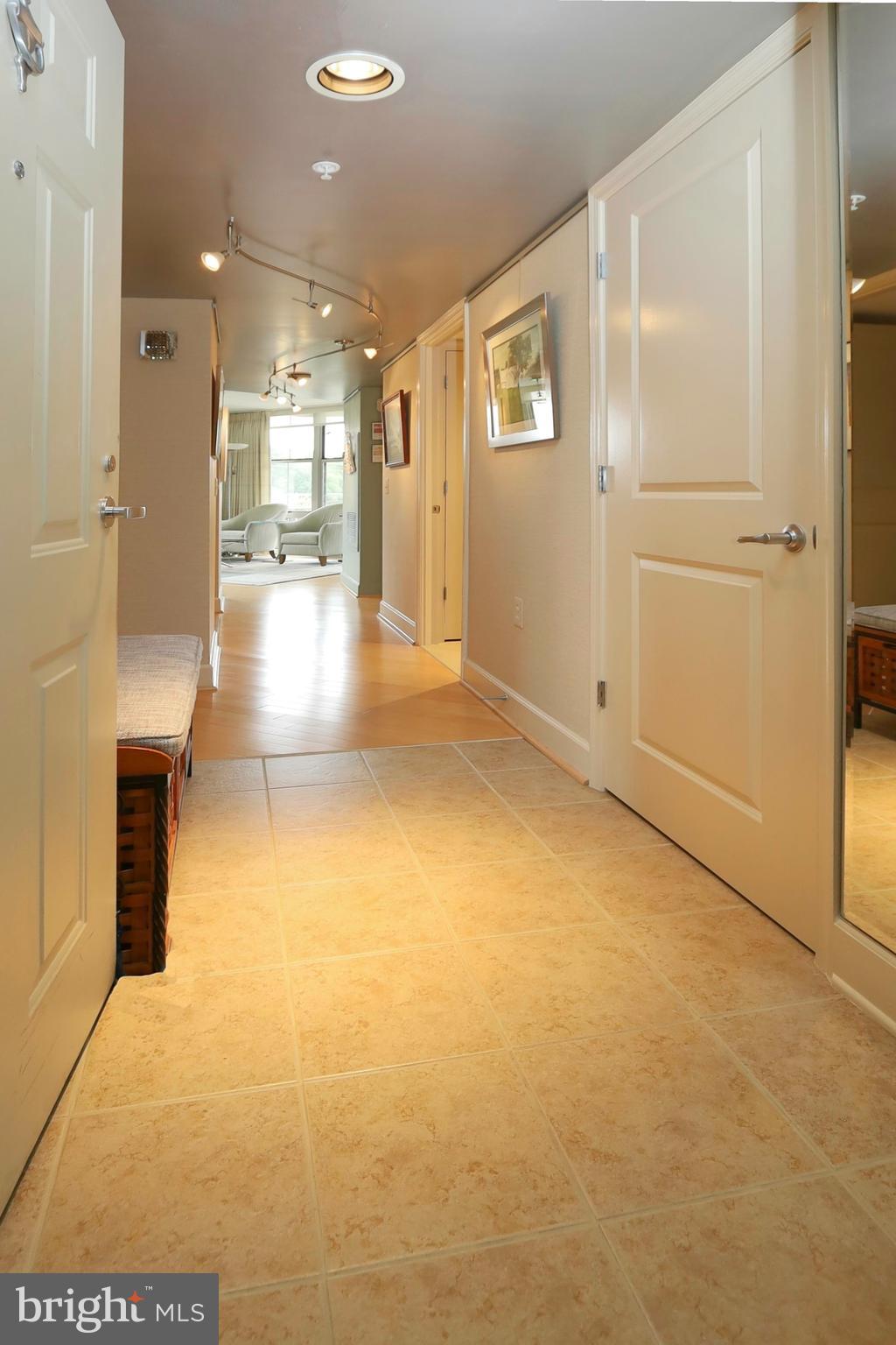 11800 Sunset Hills Road, Unit 222 Reston, VA 20190 - Photo 7 of 62 Coat closet and full-length mirror