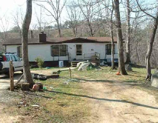 124 Wade Street Goodview, VA 24095 - Photo 1 of 1 a backyard of a house with yard and outdoor seating