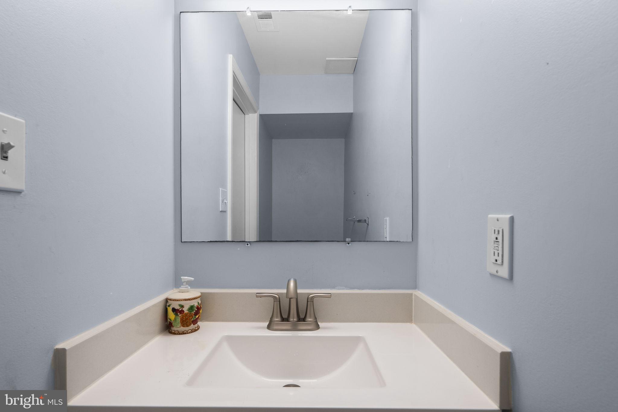 13137 Broadmore Road Silver Spring, MD 20904 - Photo 11 of 28 a bathroom with a sink and a window