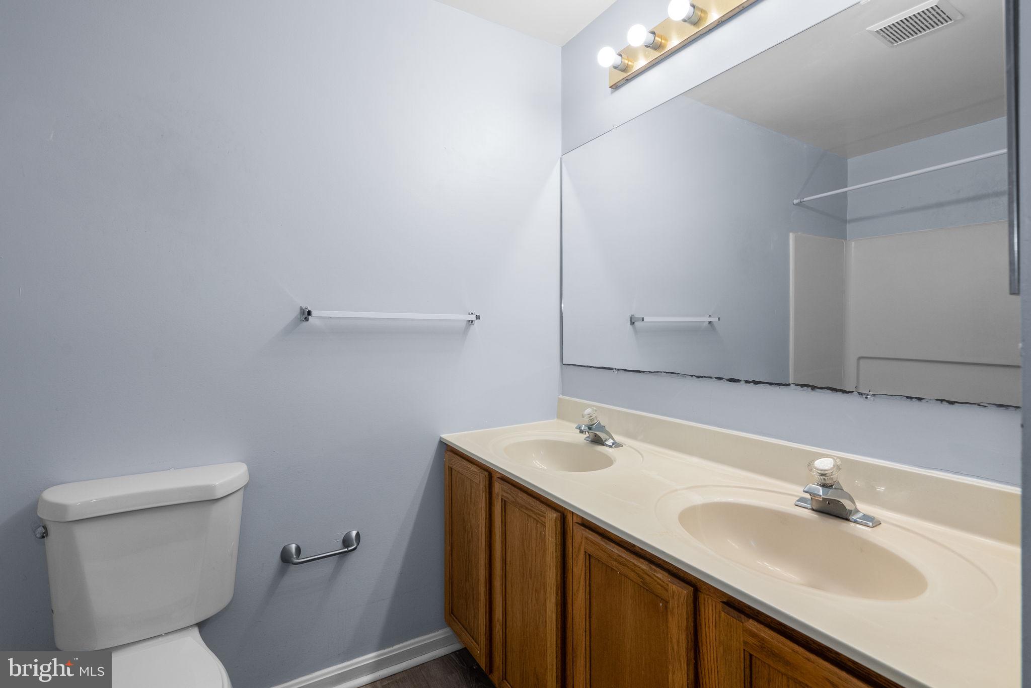 13137 Broadmore Road Silver Spring, MD 20904 - Photo 22 of 28 a bathroom with a sink and a toilet