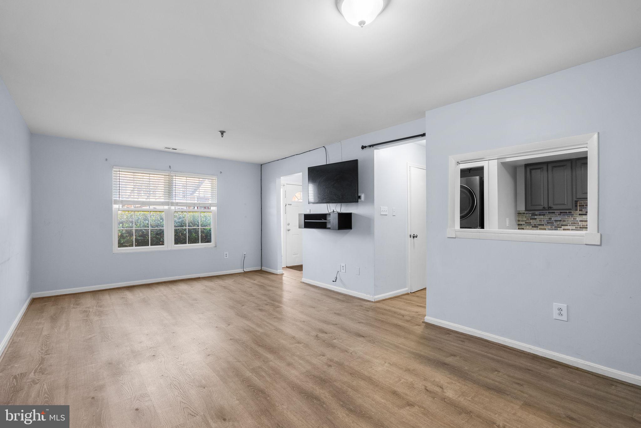 13137 Broadmore Road Silver Spring, MD 20904 - Photo 6 of 28 a view of empty room with wooden floor and fan