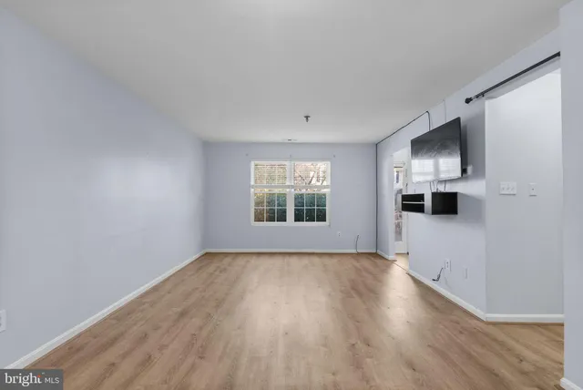 a kitchen with stainless steel appliances granite countertop a sink stove cabinets and refrigerator