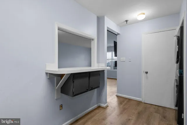 a bathroom with a sink and a window