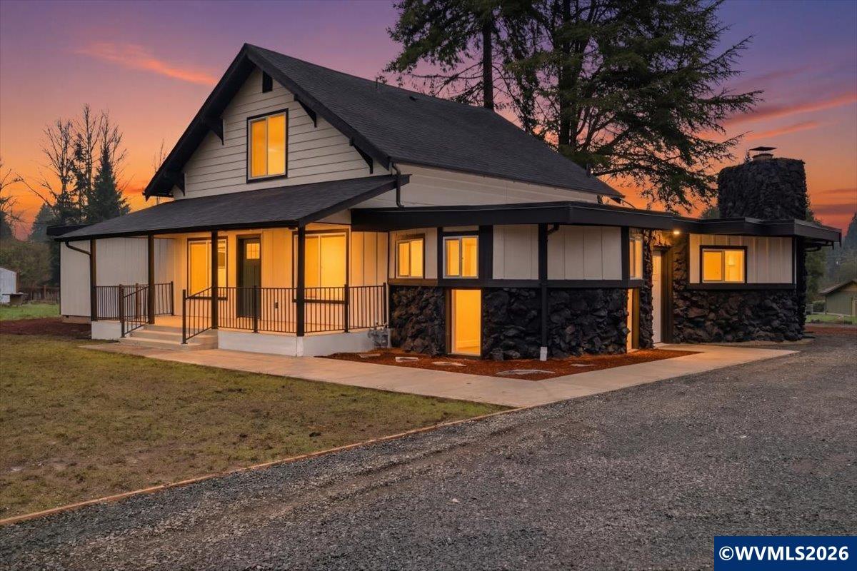 28411 Liberty Road Sweet Home, OR 97386 - Photo 2 of 50 a front view of a house with basket ball court and porch