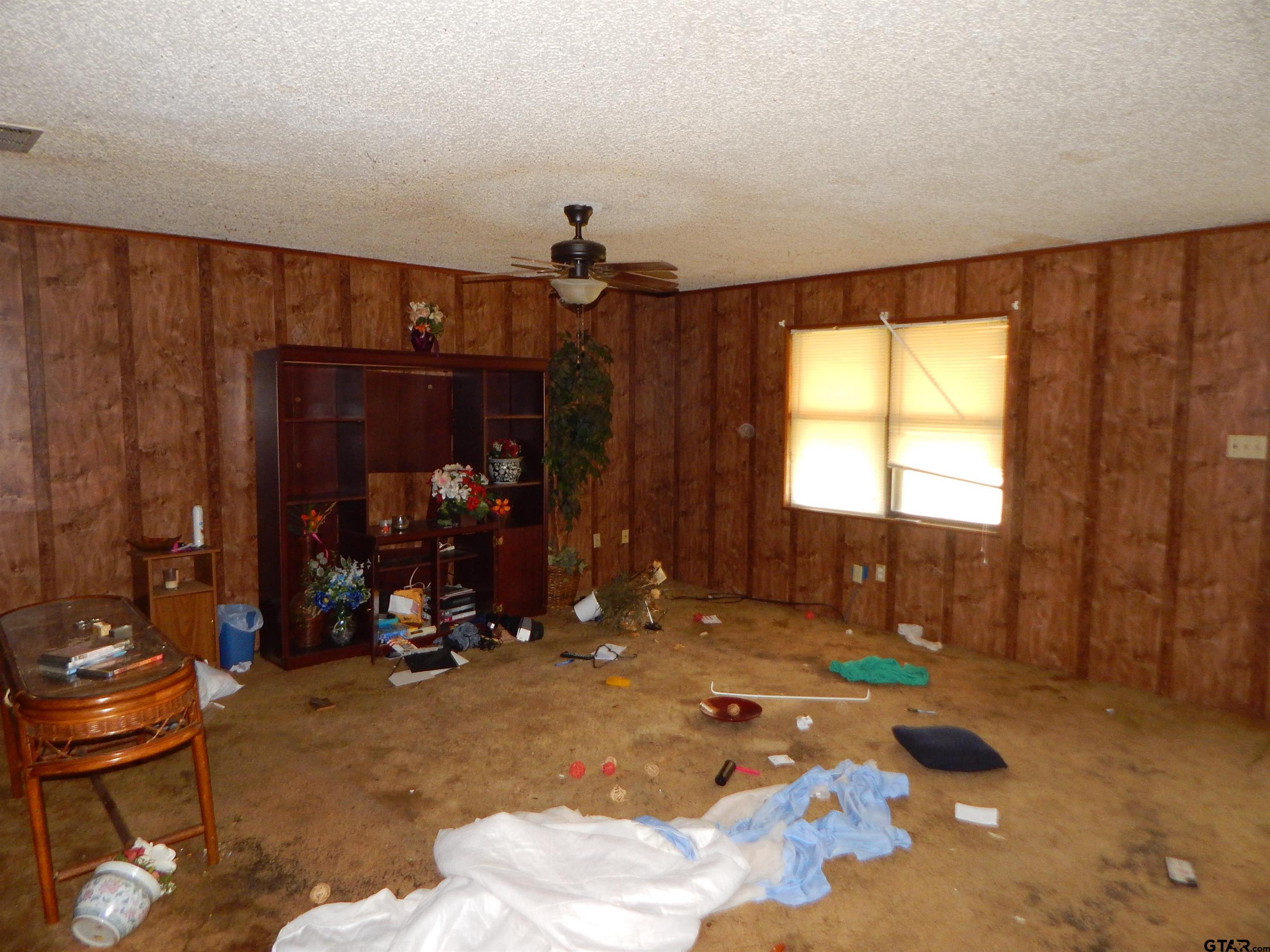 2741 Toad Road Gilmer, TX 75644 - Photo 14 of 20 a room with gym equipment and a large window