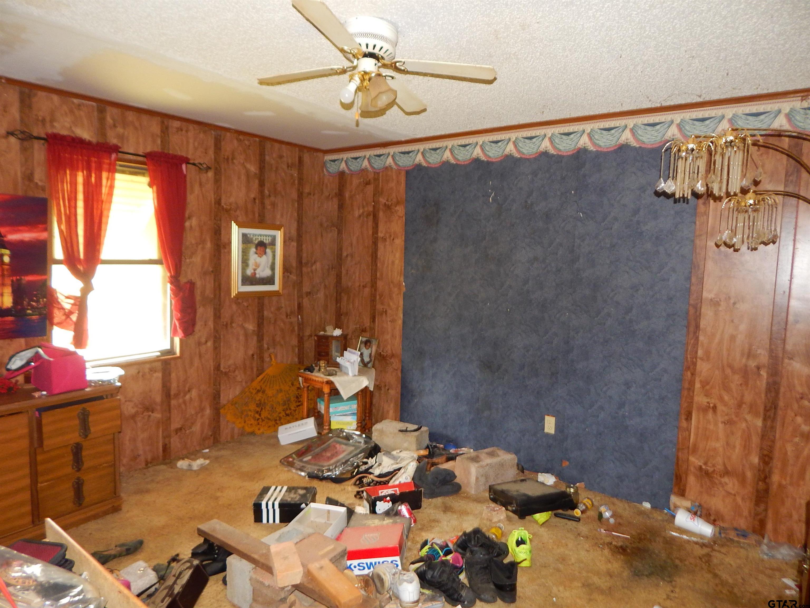 2741 Toad Road Gilmer, TX 75644 - Photo 17 of 20 a bathroom with a sink mirror and shower