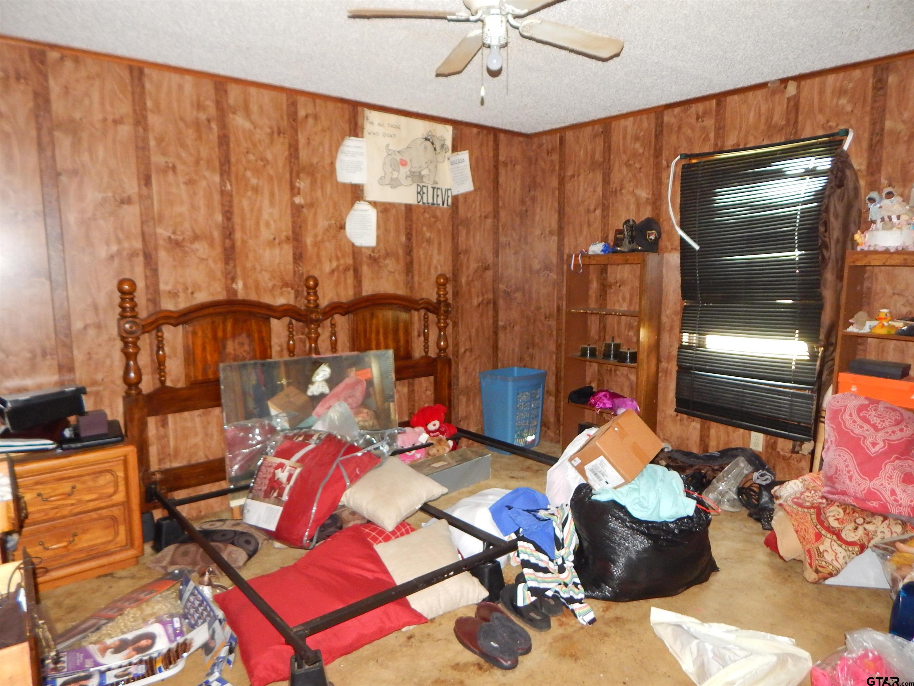 2741 Toad Road Gilmer, TX 75644 - Photo 18 of 20 a living room with furniture and a chandelier