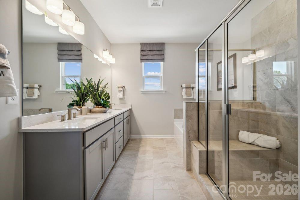 3168 Beacon Hts Road Indian Land, SC 29707 - Photo 16 of 36 a bathroom with a sink a toilet and shower