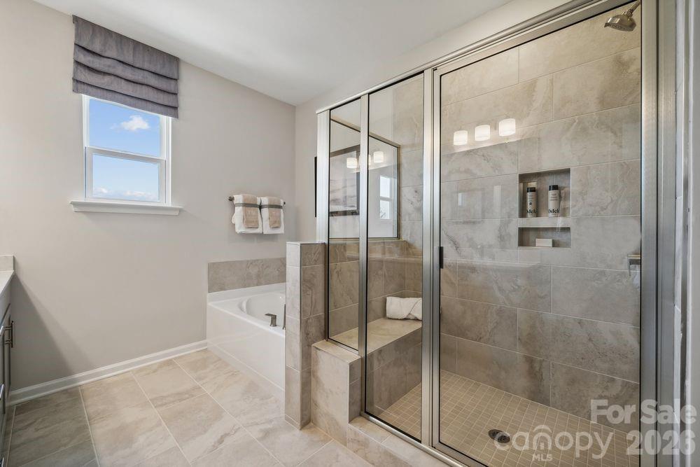 3168 Beacon Hts Road Indian Land, SC 29707 - Photo 17 of 36 a bathroom with a shower and a sink