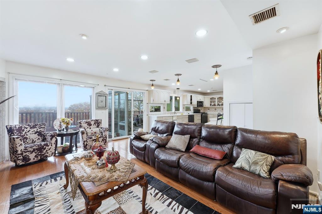 703 Stewart Street Ridgefield, NJ 07657 - Photo 15 of 38 a living room with furniture and a large window
