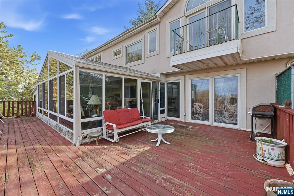 703 Stewart Street Ridgefield, NJ 07657 - Photo 31 of 38 a view of a two chair in the balcony