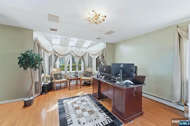 a living room with furniture a table and a potted plant