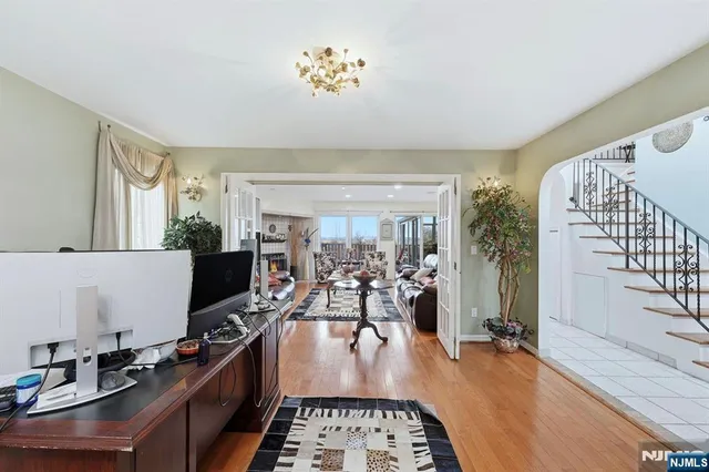 a kitchen with furniture and a flat screen tv