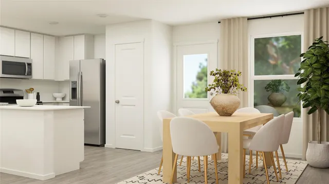 a view of a kitchen with a sink and wooden floor
