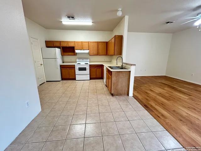 a kitchen with stainless steel appliances a sink and a stove top oven
