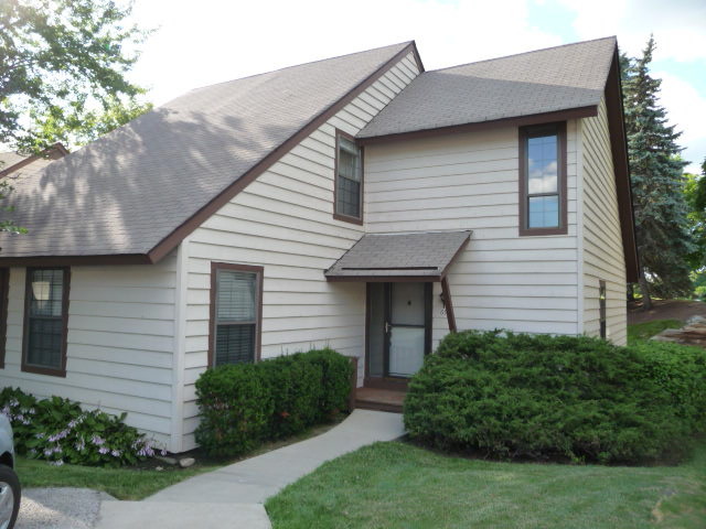 694 Chandler Road Gurnee, IL 60031 - Photo 1 of 16 a front view of a house with a yard