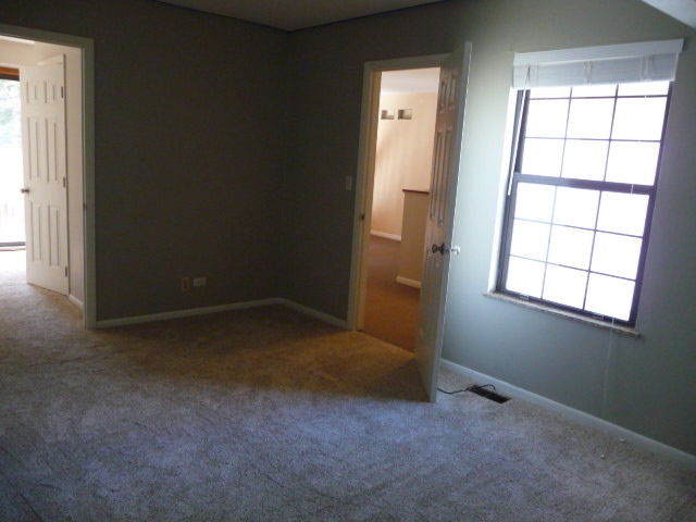 694 Chandler Road Gurnee, IL 60031 - Photo 9 of 16 an empty room with windows